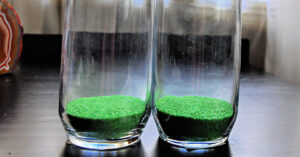 Green sand in the bottom of glasses