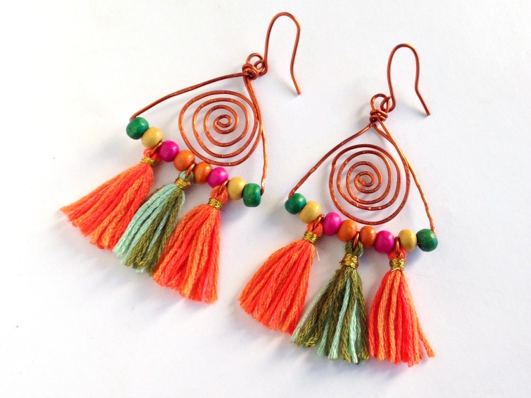 A pair of cute dangle boho earrings on white background