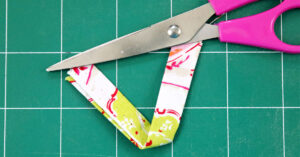 Cut fabric strip for hanging pot holder
