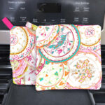 Two homemade paisley printed pot holders on an oven