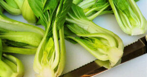 Clean bok choy cut in half lengthwise.